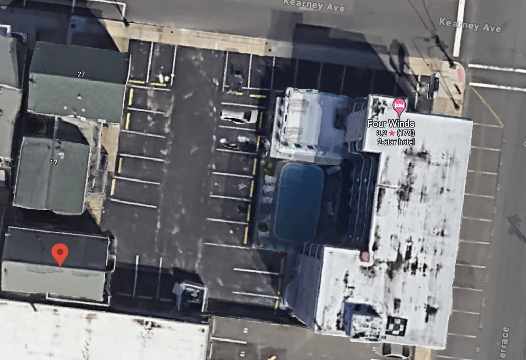 The Four Winds Motel and three adjacent buildings which are planned for demolition. (Credit: Google Earth)